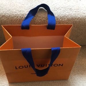 Louis Vuitton gift bag with handles and blue ribbon